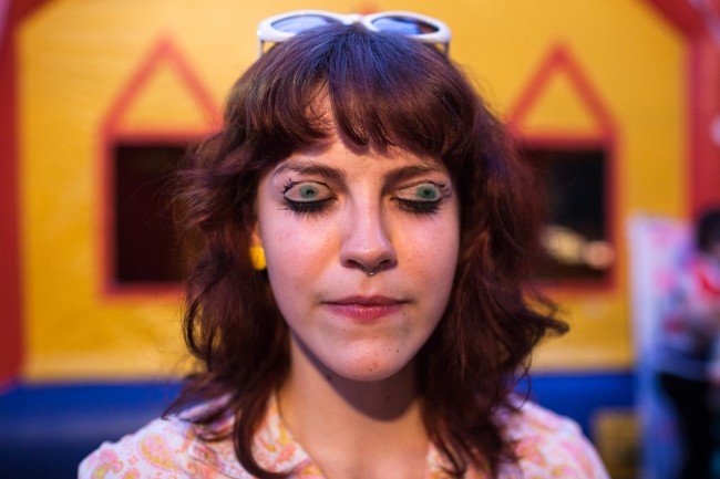 A woman's disguise photographed at a carnival.